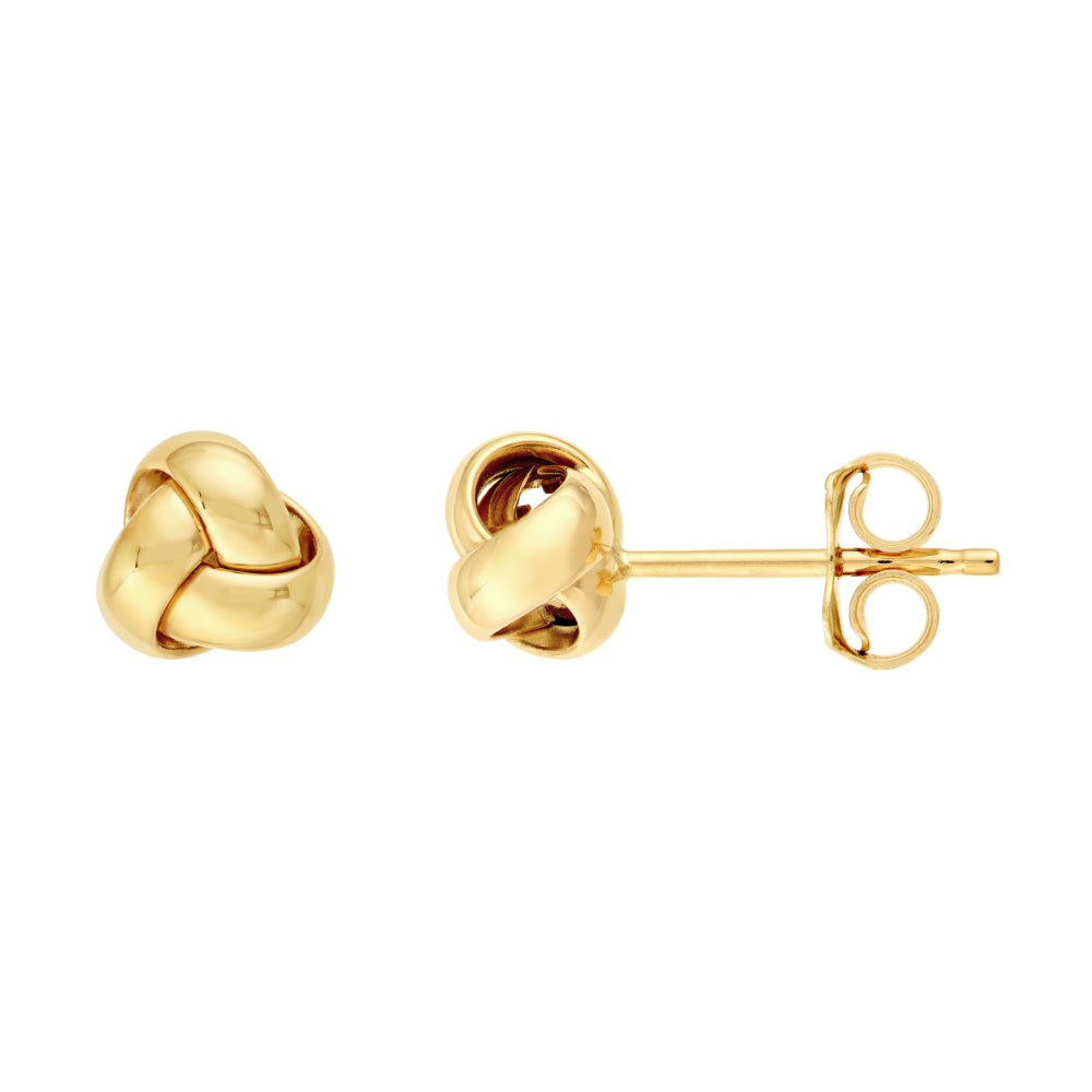 gold love knot stud earrings on white background