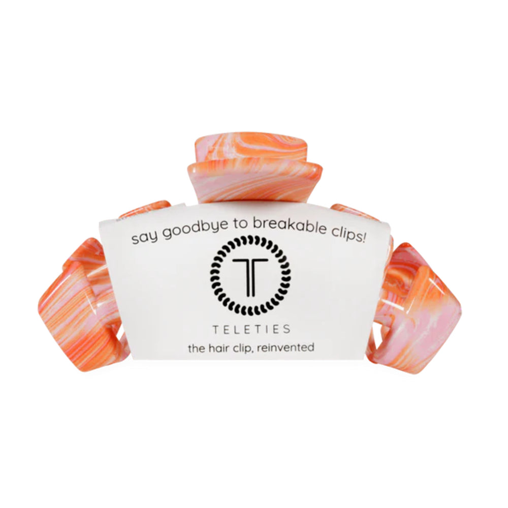 Marbled hair clip with Teleties branding on a white background