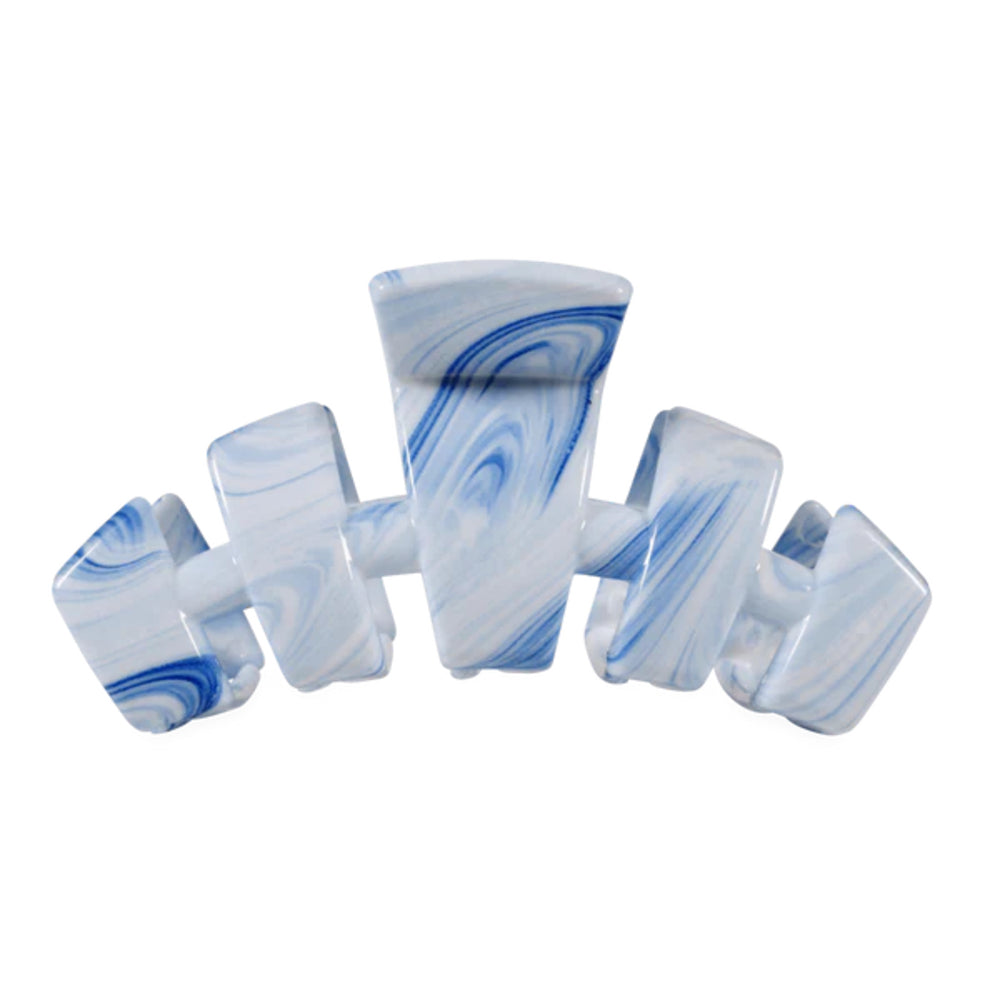 Marble-patterned hair clip on a white background