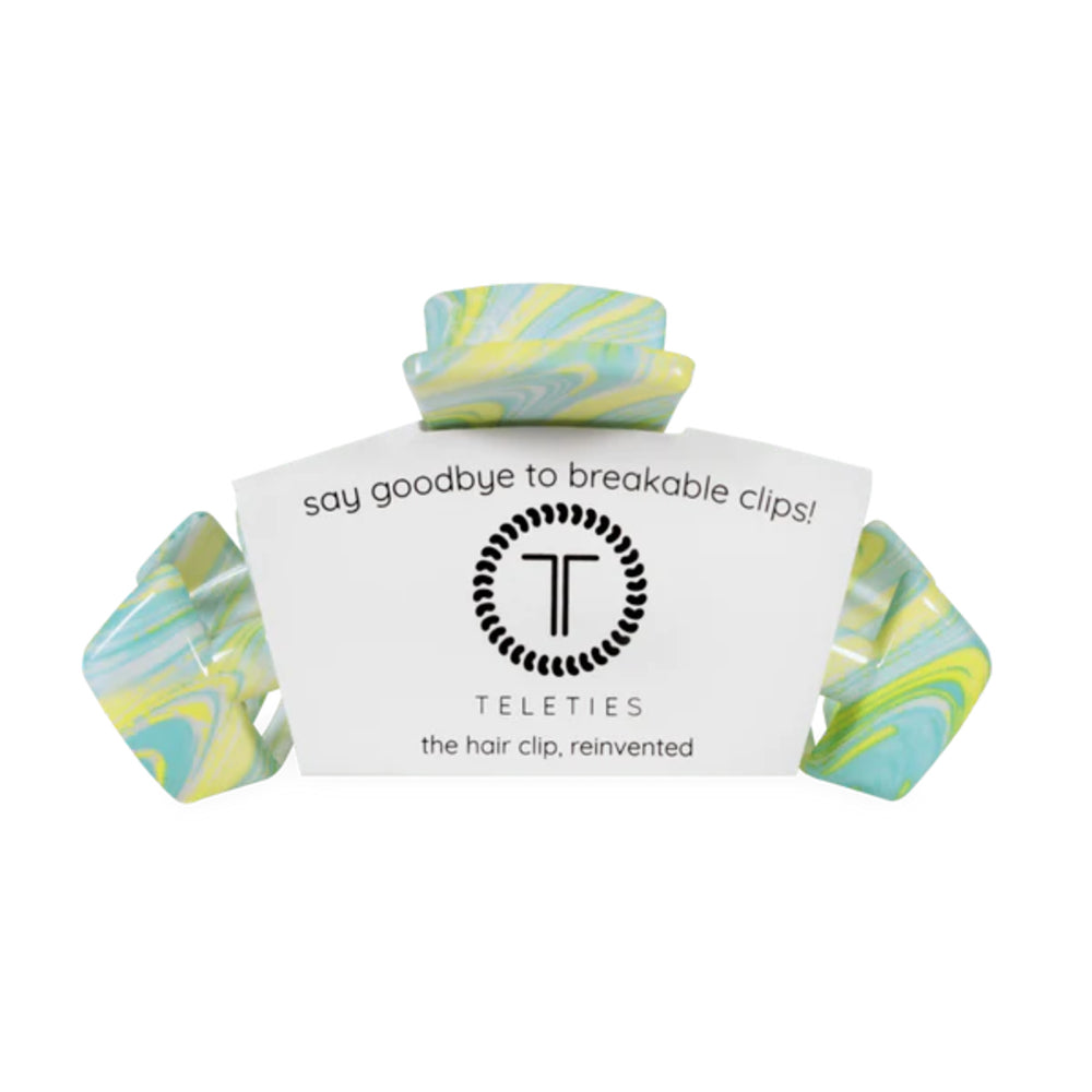 Marbled green and blue hair clip with Teleties branding on a white background