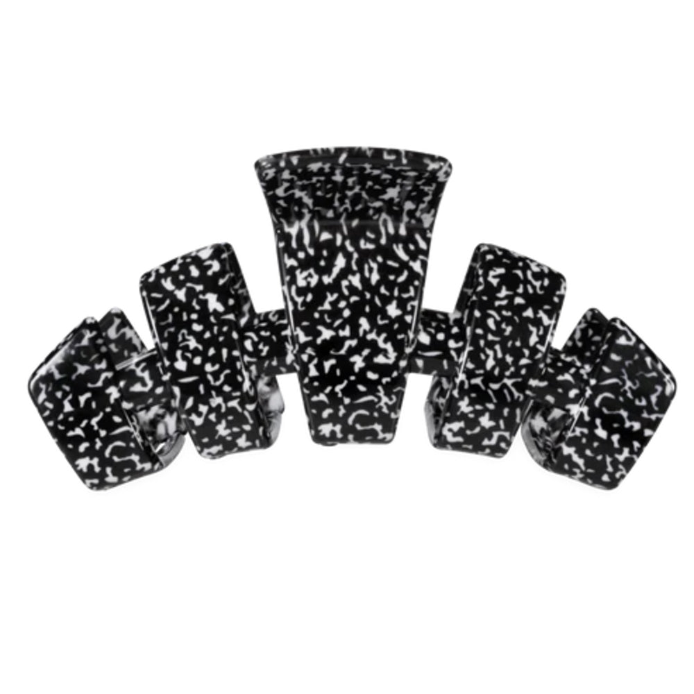 A set of six black and white marbled acrylic hair claw clips arranged symmetrically on a plain white background.