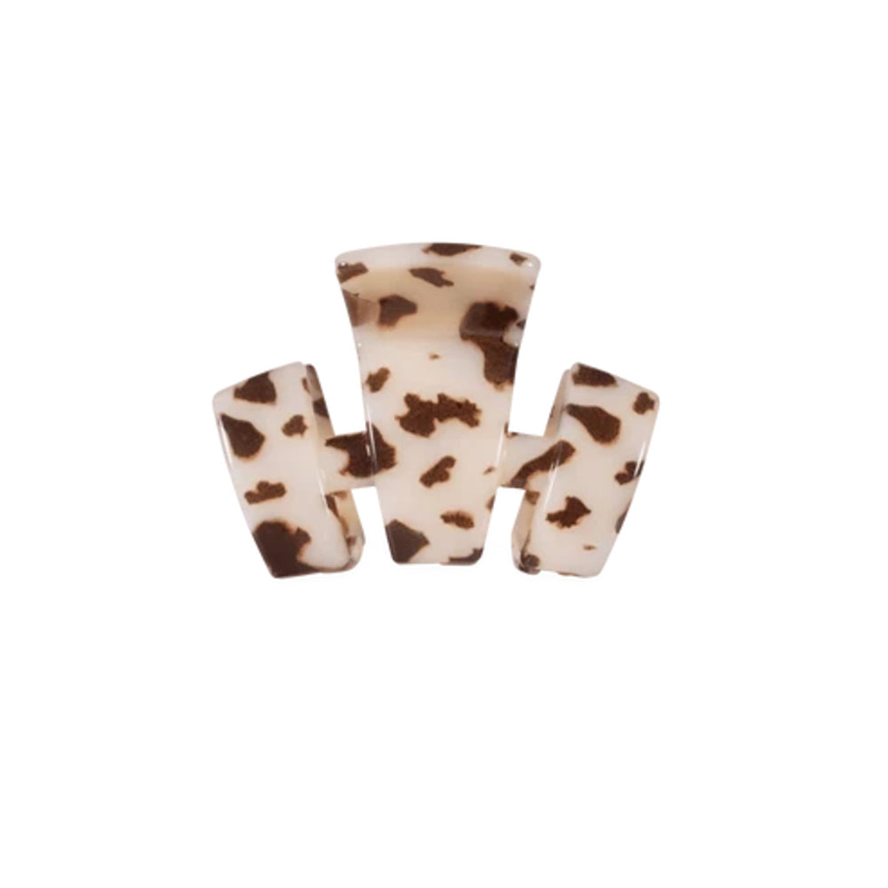 A three-prong claw hair clip with a brown and cream tortoiseshell pattern, shown against a plain white background.