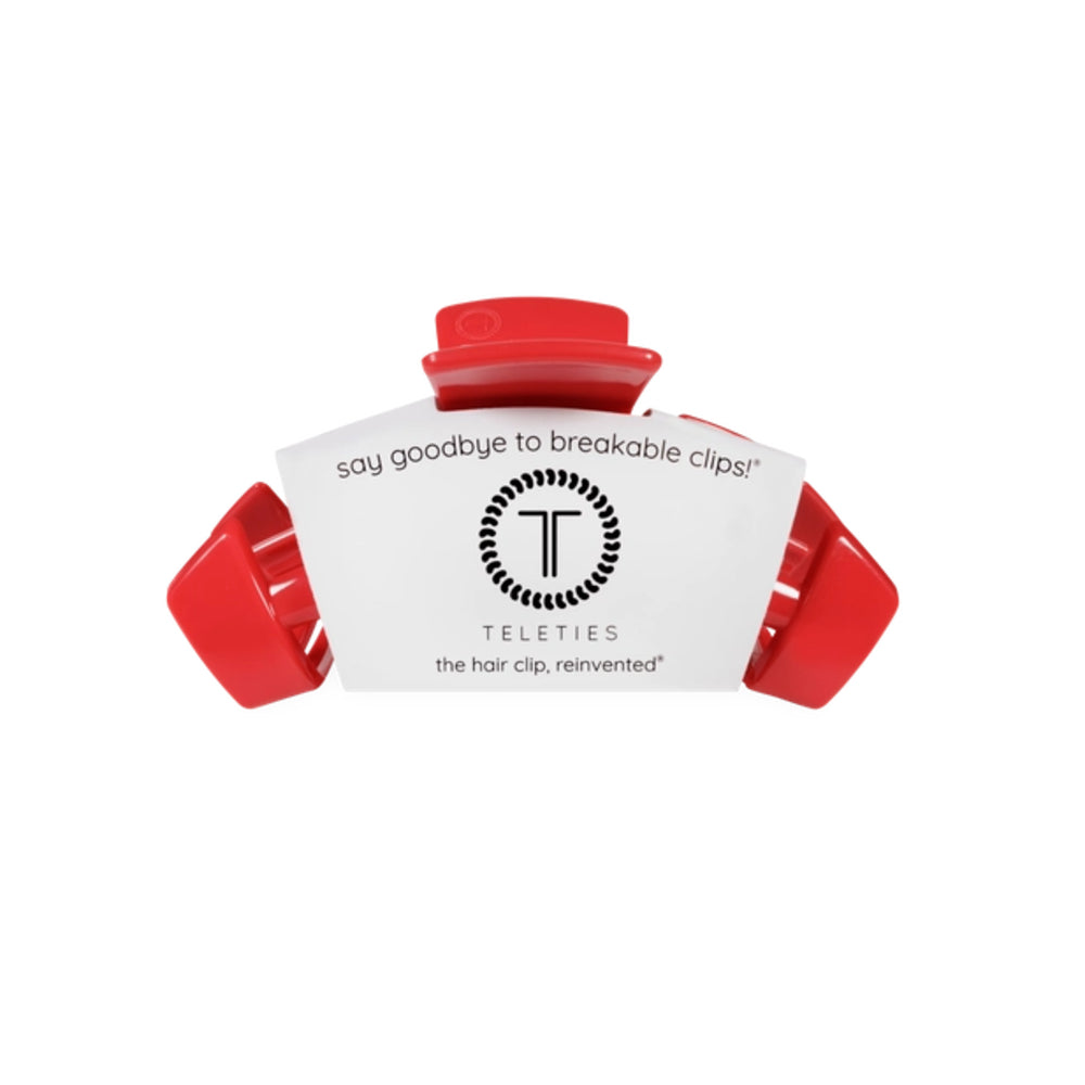 Red hair clip with Teleties branding on a white background