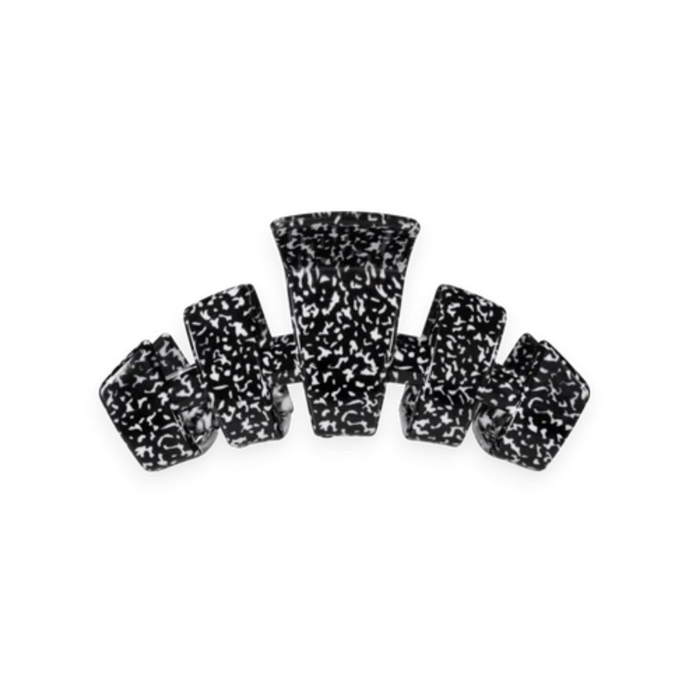 A black and white speckled hair claw clip shown against a plain white background.