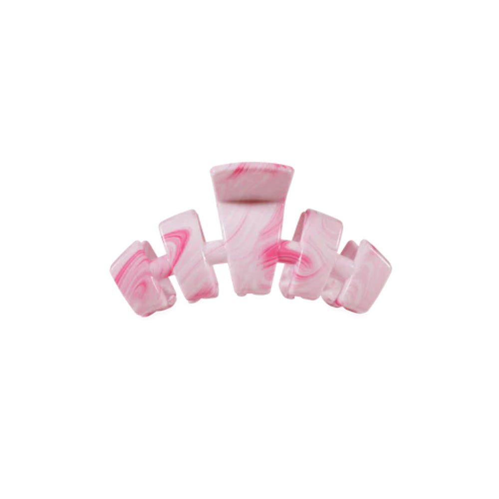 Pink and white marbled hair clip on a white background