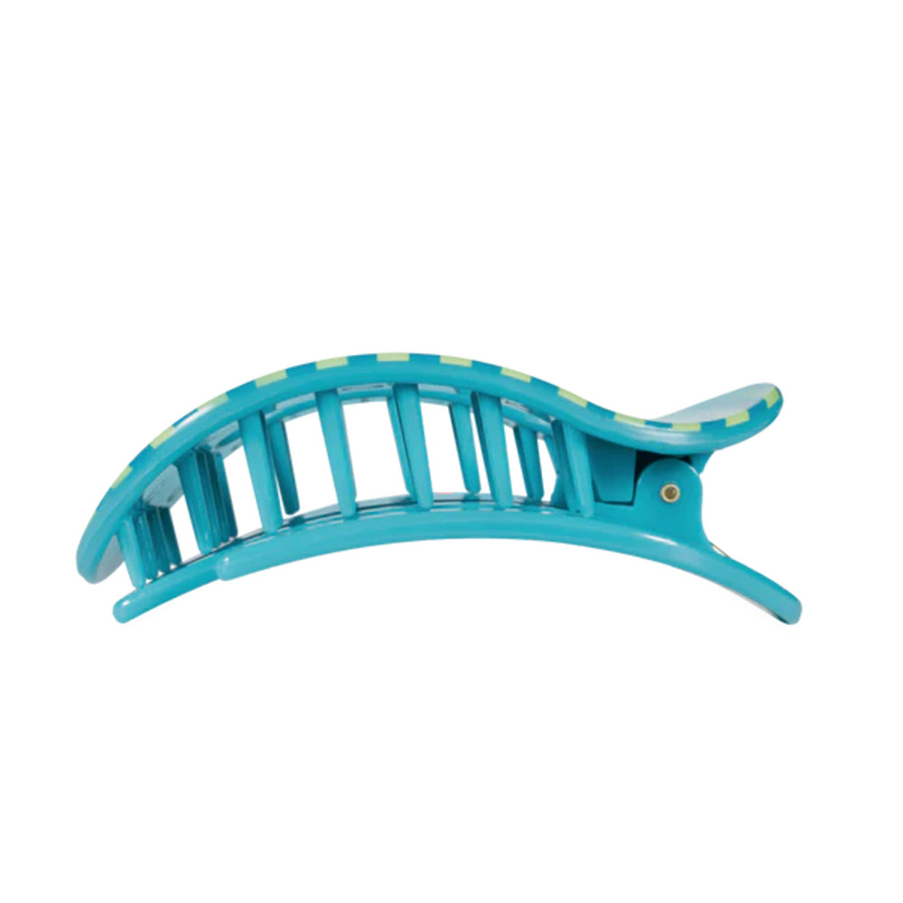 Turquoise hair clip on a white background