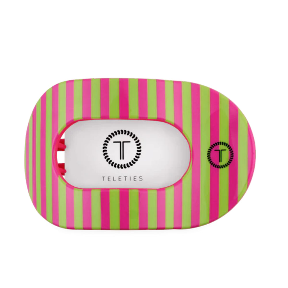 Pink and green striped hair clip with 'Teleties' logo on a white background