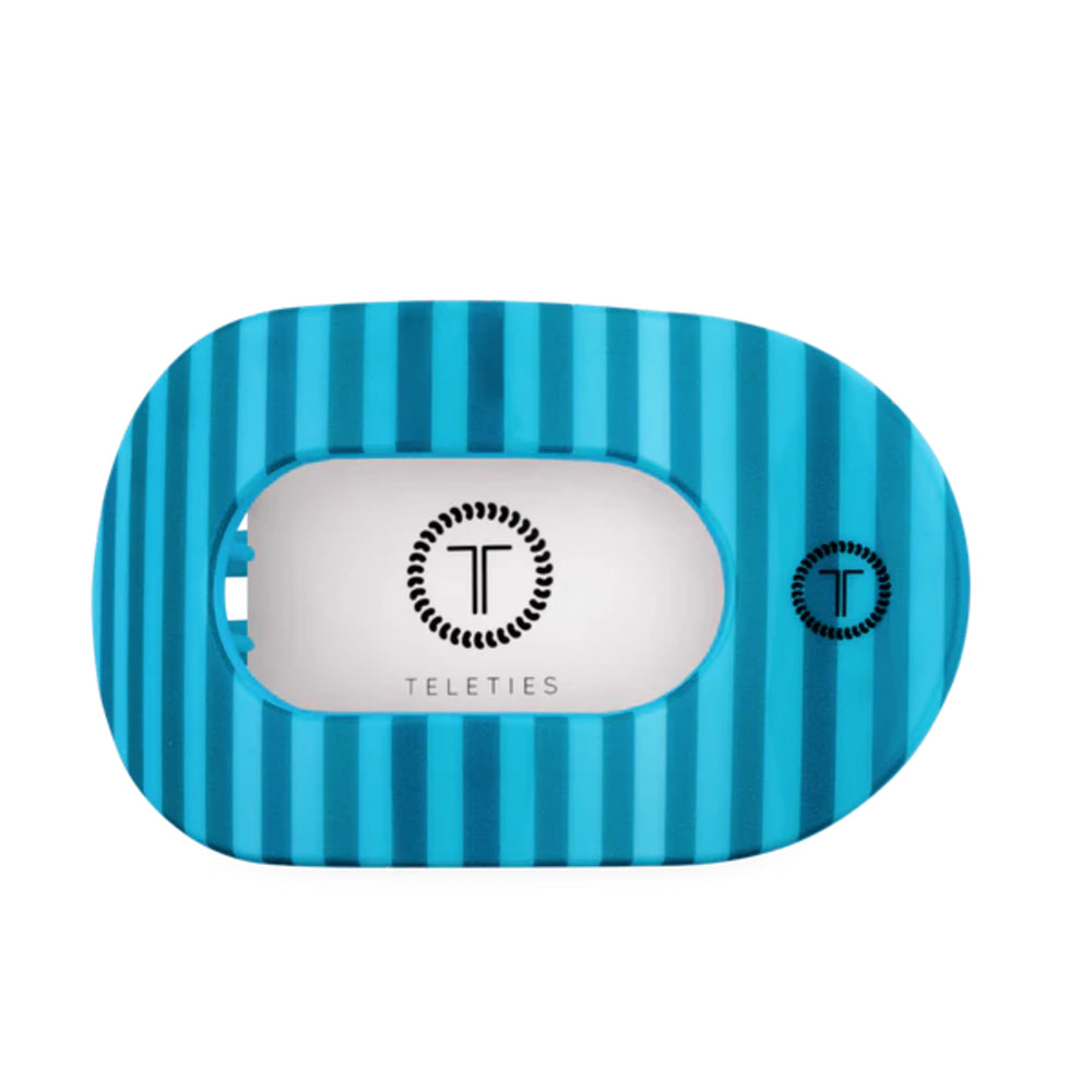 Blue striped hair clip with 'Teleties' branding on a white background