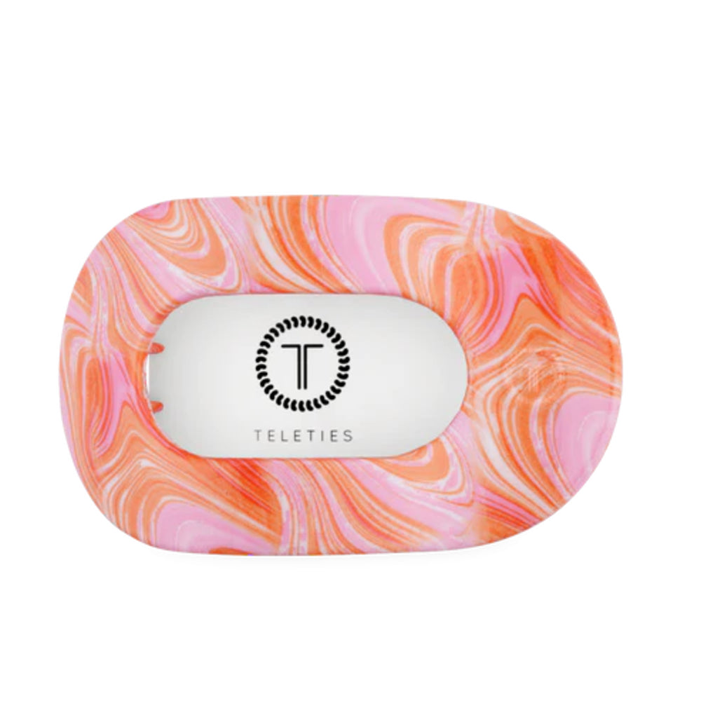 Marbled pink and orange hair clip with 'Teleties' logo on a white background