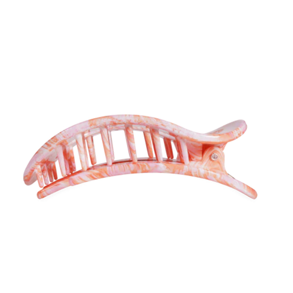 Pink and white hair clip on a white background