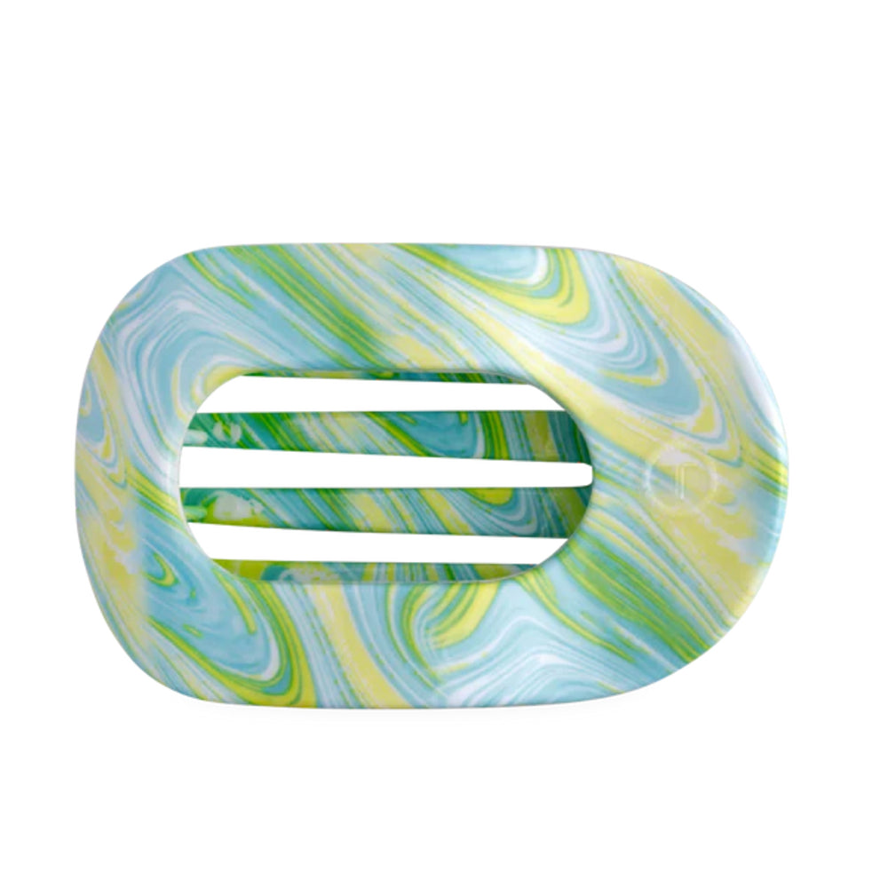 Marbled green and blue hair clip on a white background