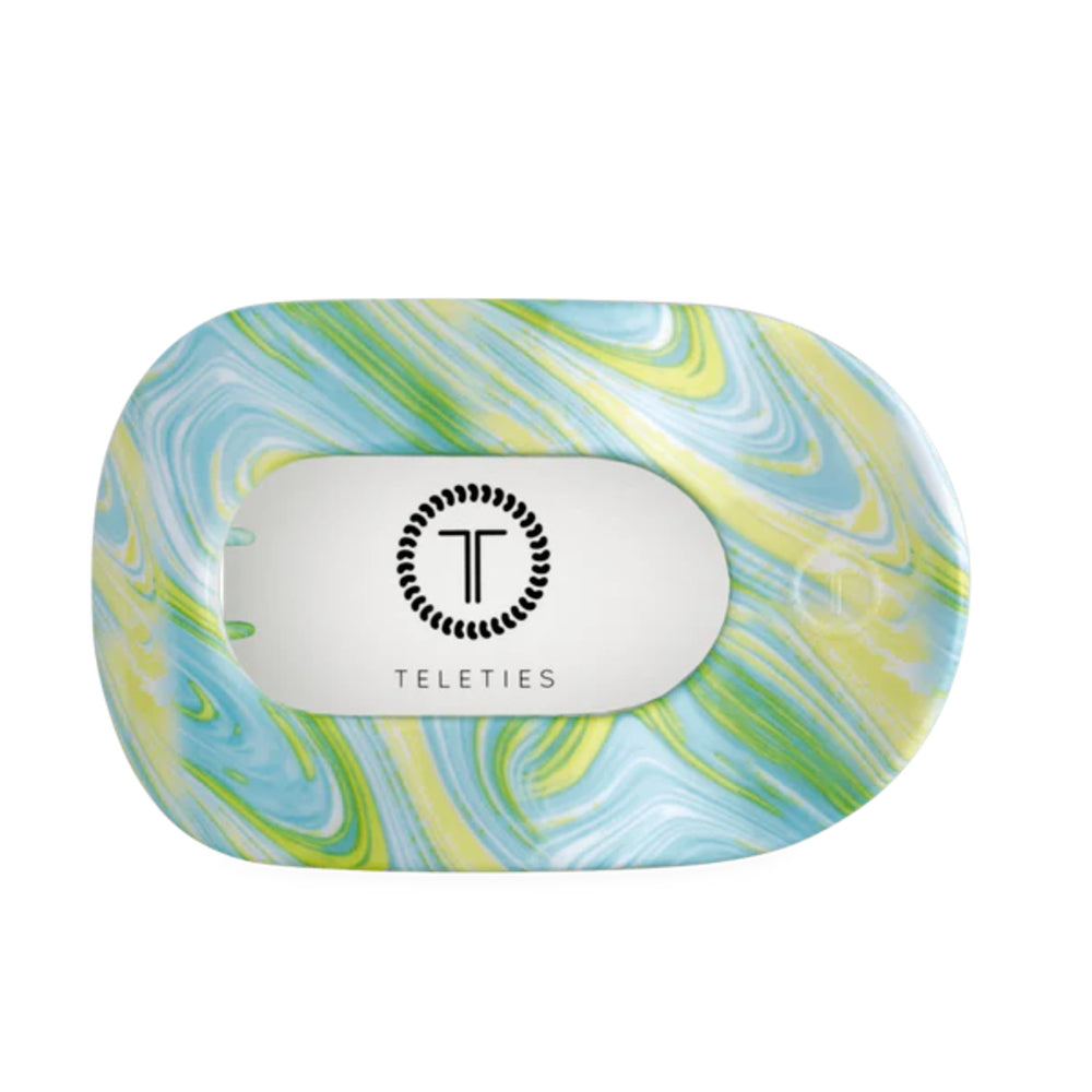 Marbled design product hair clip with 'Teleties' branding on a white background