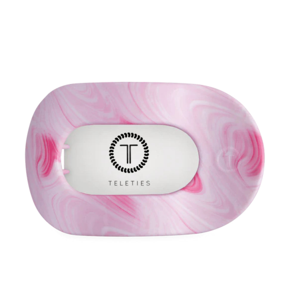 Pink marbled hair clip with 'Teleties' logo on a white background