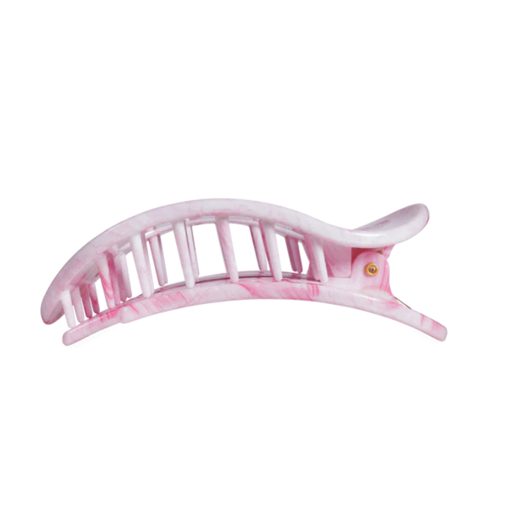 Pink marbled hair clip on a white background