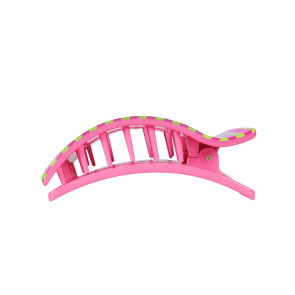 Pink hair clip with green accents on a white background