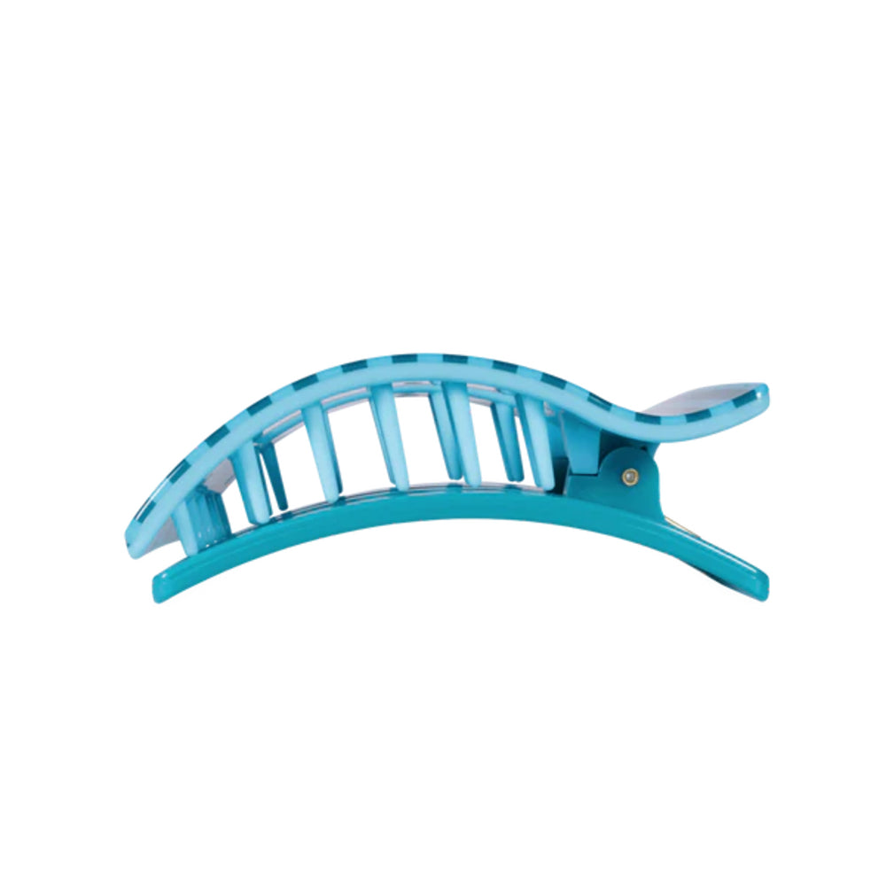 Turquoise hair clip on a white background