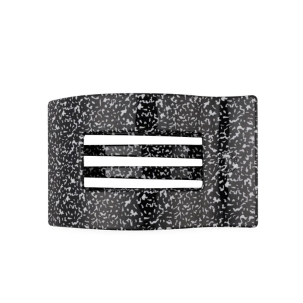A black and white speckled resin cuff bracelet with three horizontal white bars in the center, shown against a plain white background.