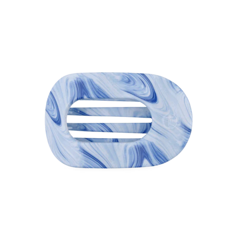 Marble-patterned hair clip with blue and white swirls on a white background