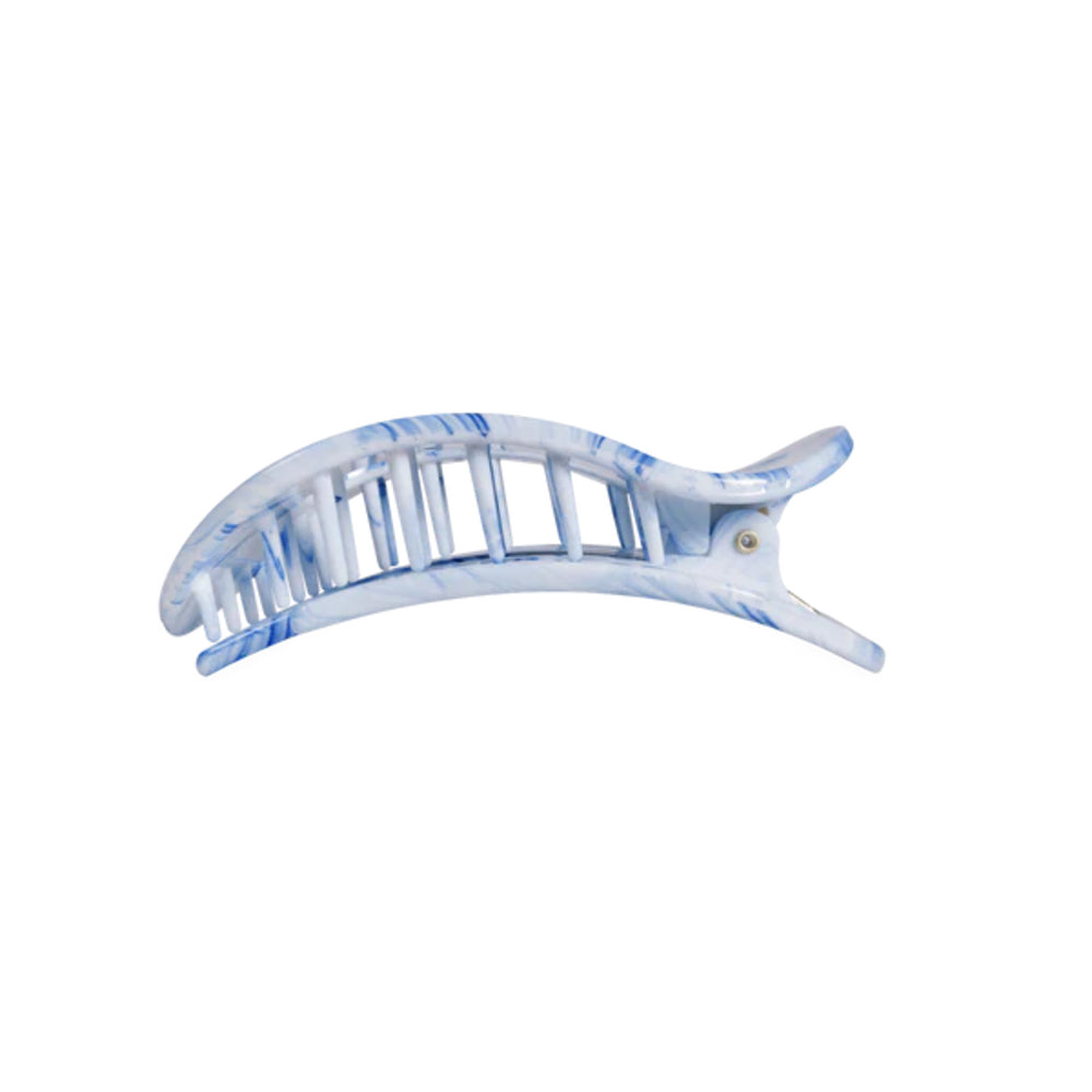 Blue and white hair clip on a white background