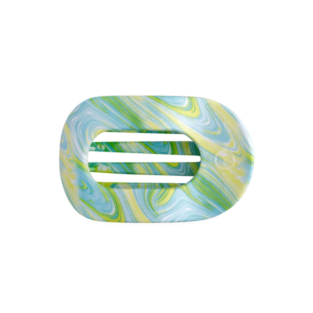 Marbled rectangular hair clip with a white center on a white background