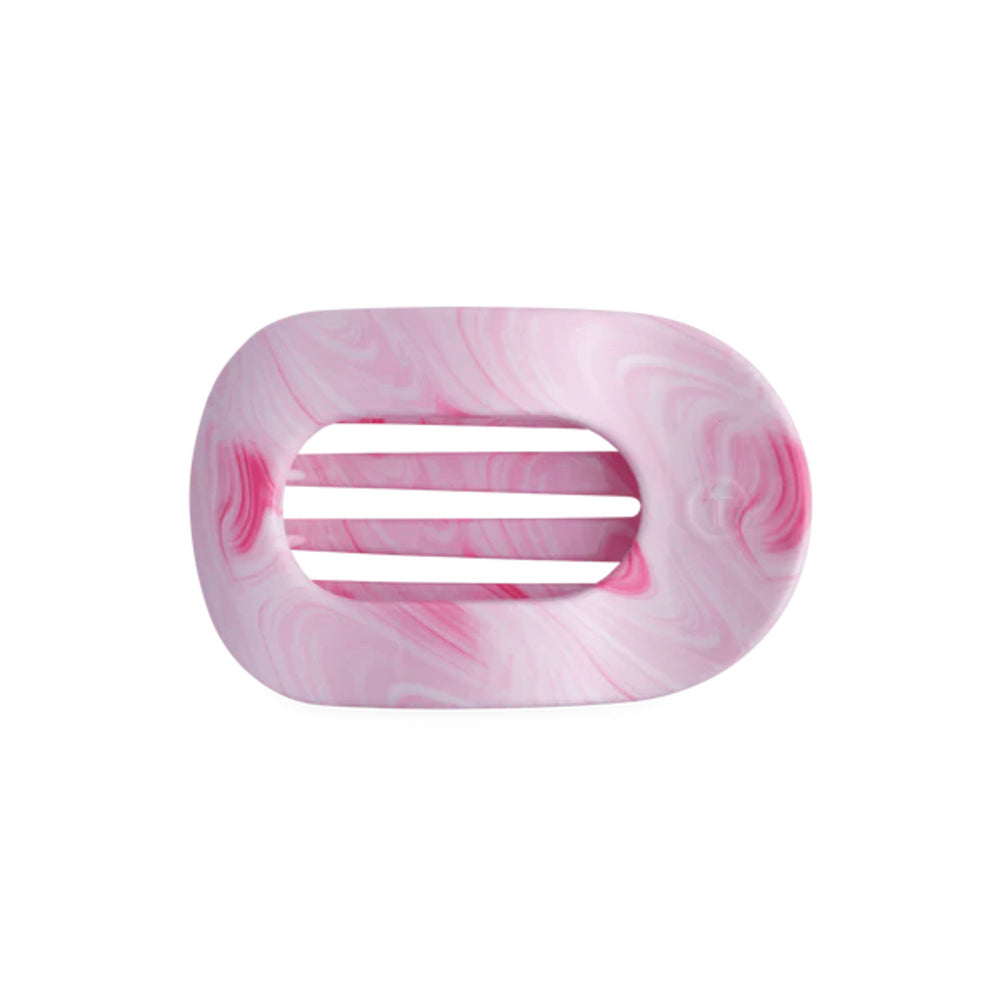 Marbled pink and white hair clip on a white background