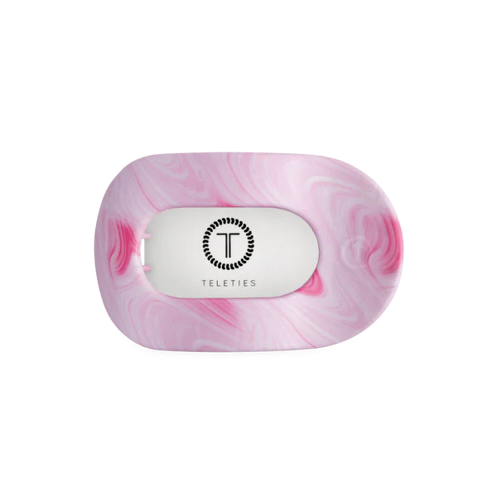 Pink marbled hair clip with a white label featuring 'Teleties' on a white background