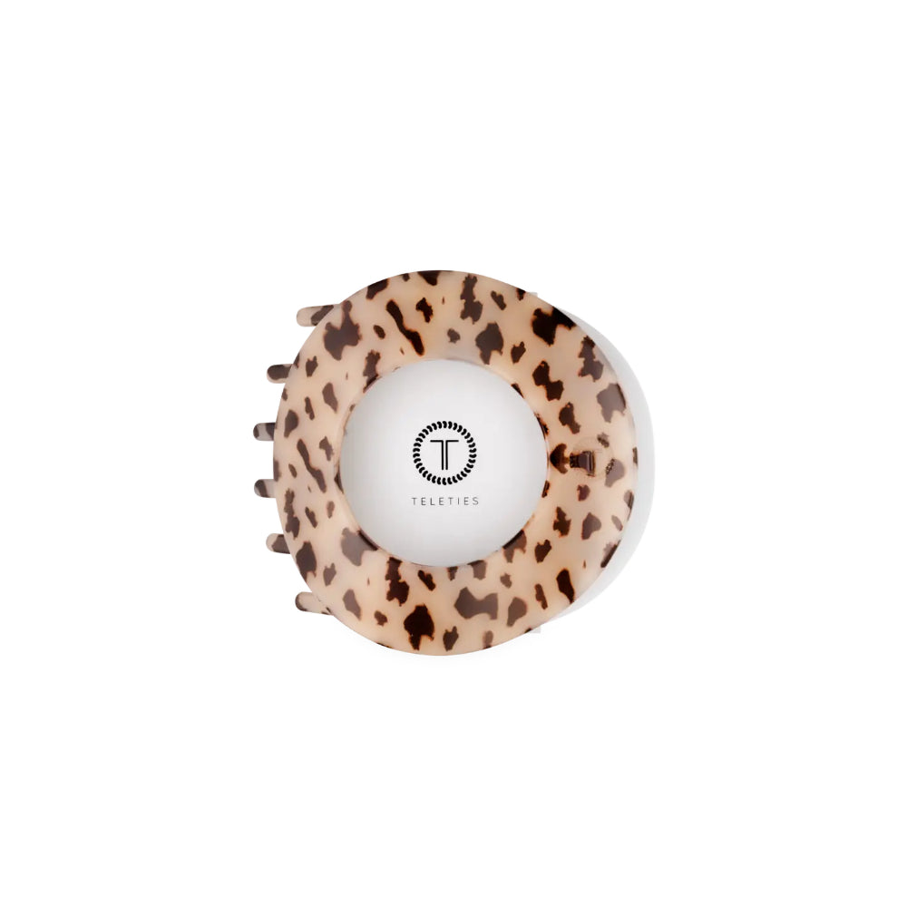 A Teleties hair claw clip with a leopard print pattern in beige and brown, featuring a white center with the brand logo. (Medium)