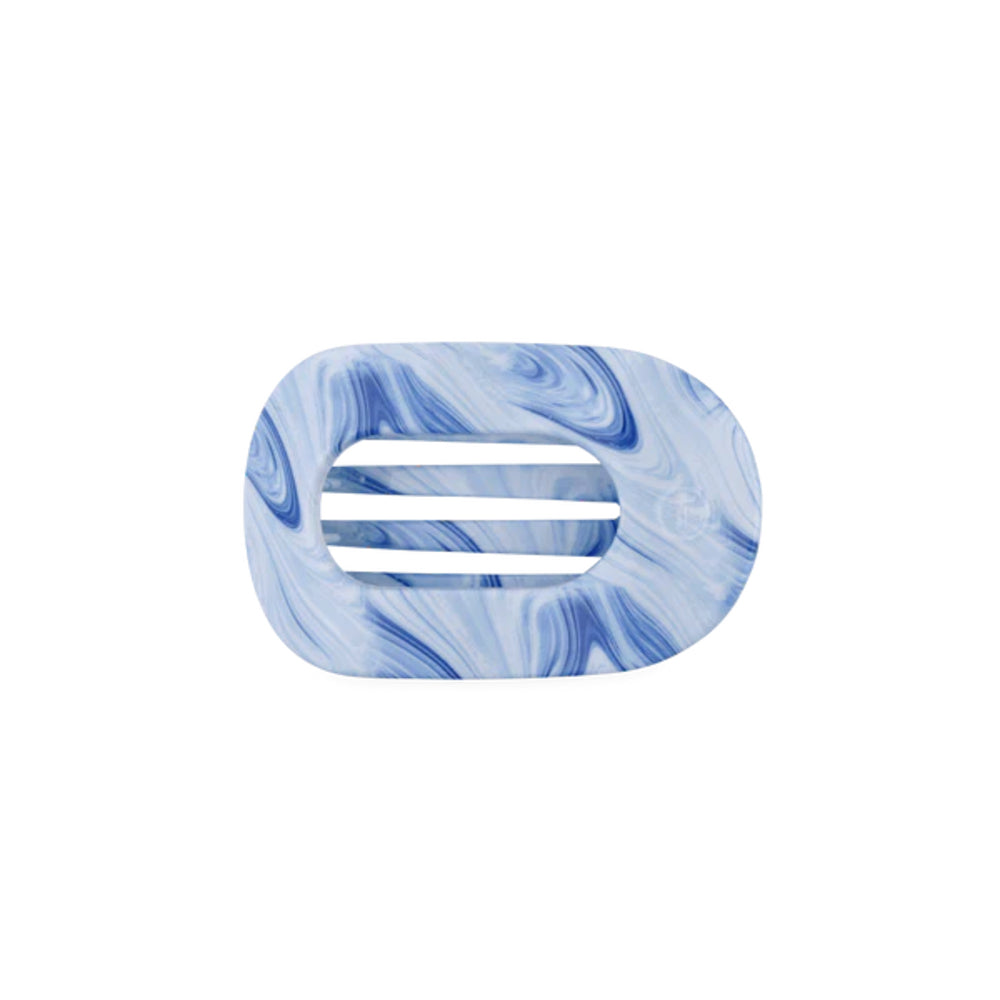 Blue marbled hair clip on a white background