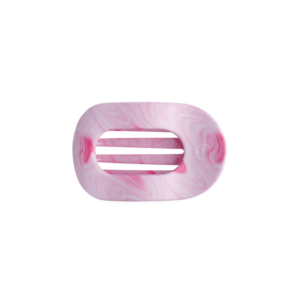 Pink marbled hair clip on a white background