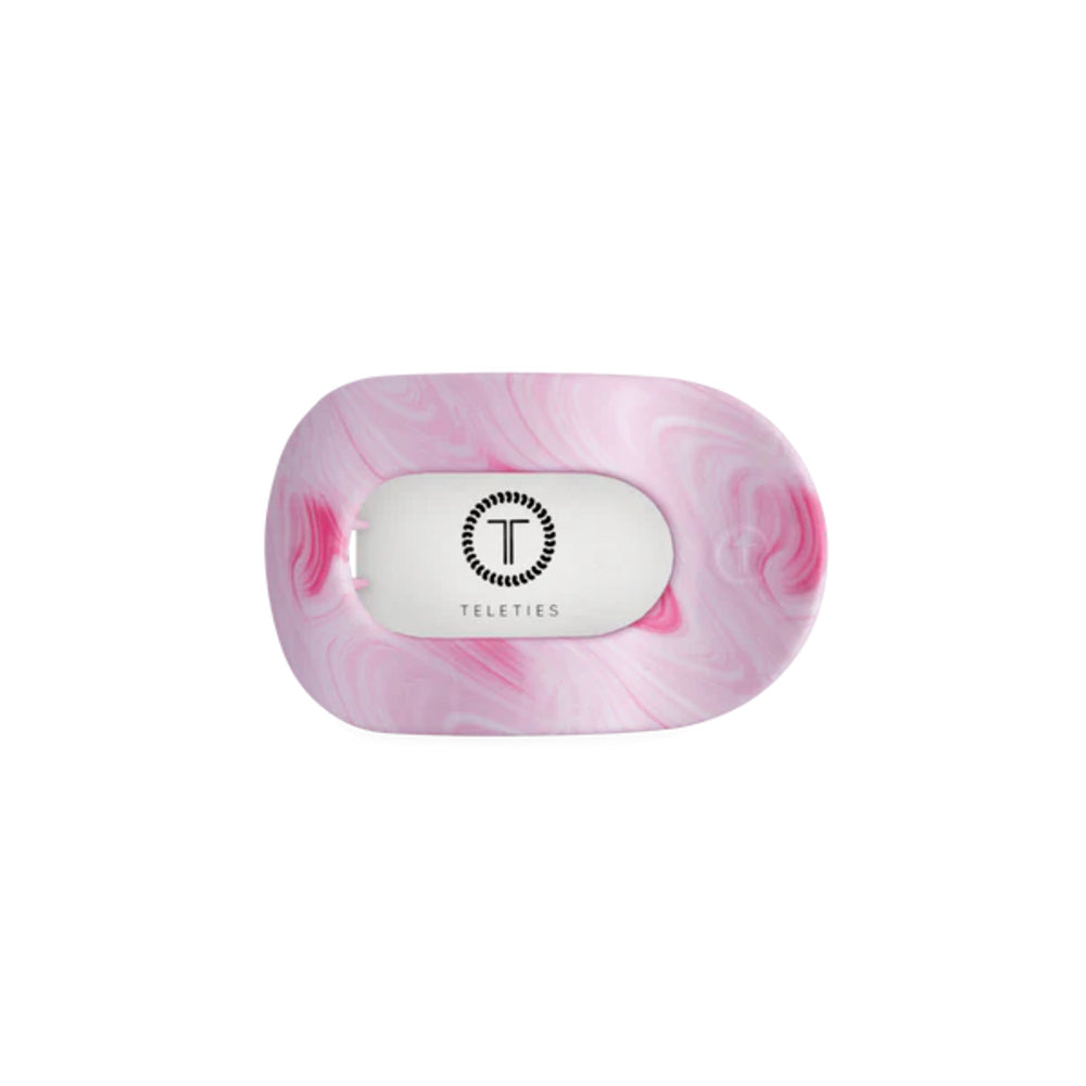 Pink marbled hair clip with 'Teleties' branding on a white background
