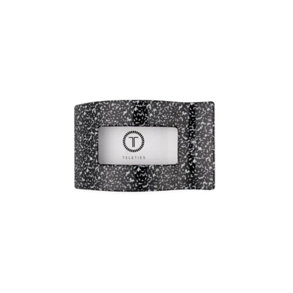 A black and white speckled silicone wristband with a central silver metallic badge featuring a circular 'T' logo and the brand name 'TECHTIED'.