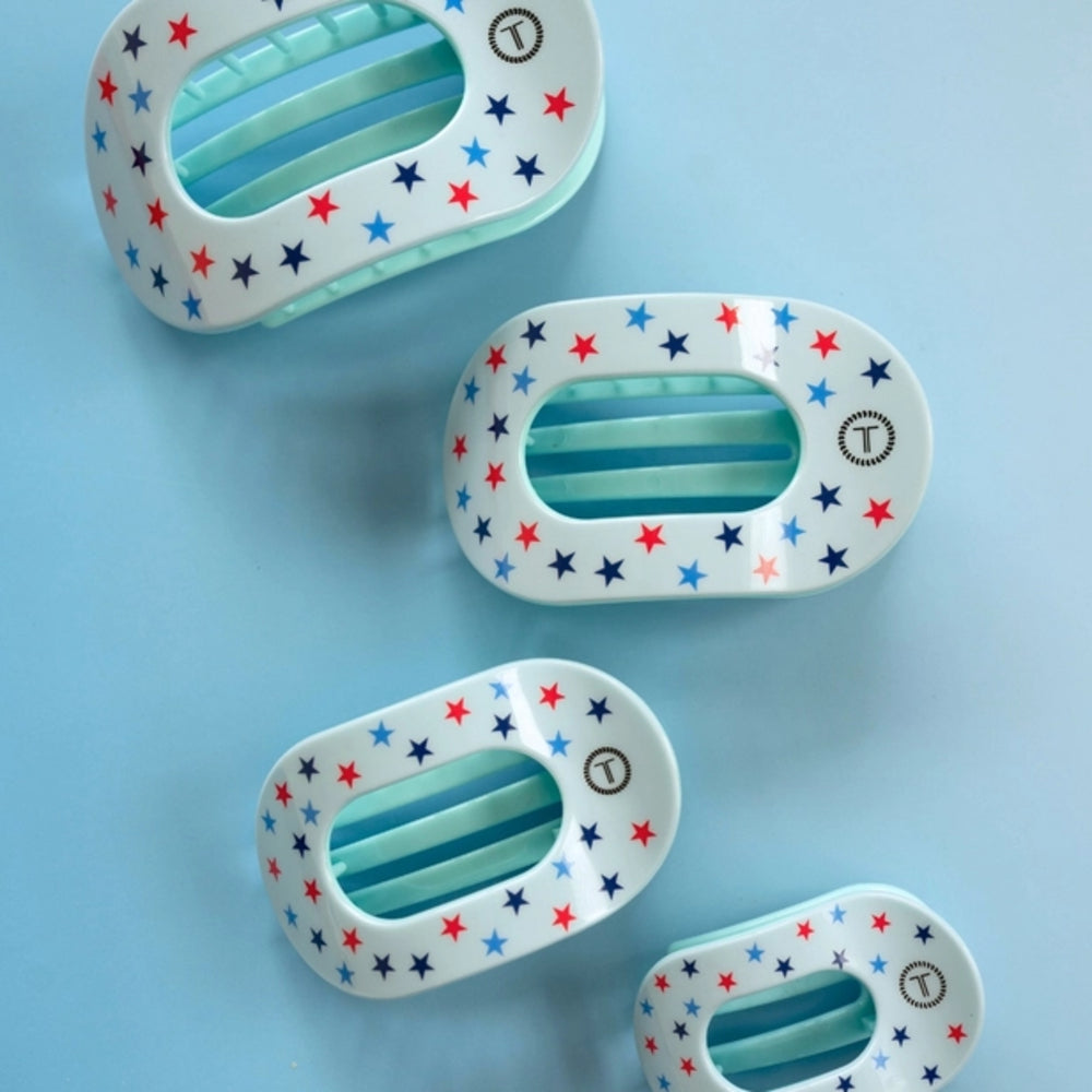 4 blue hair clips with stars