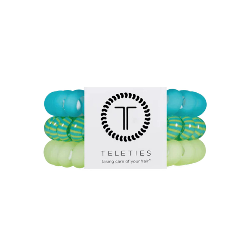 Set of green and blue hair ties with a Teleties label on a white background