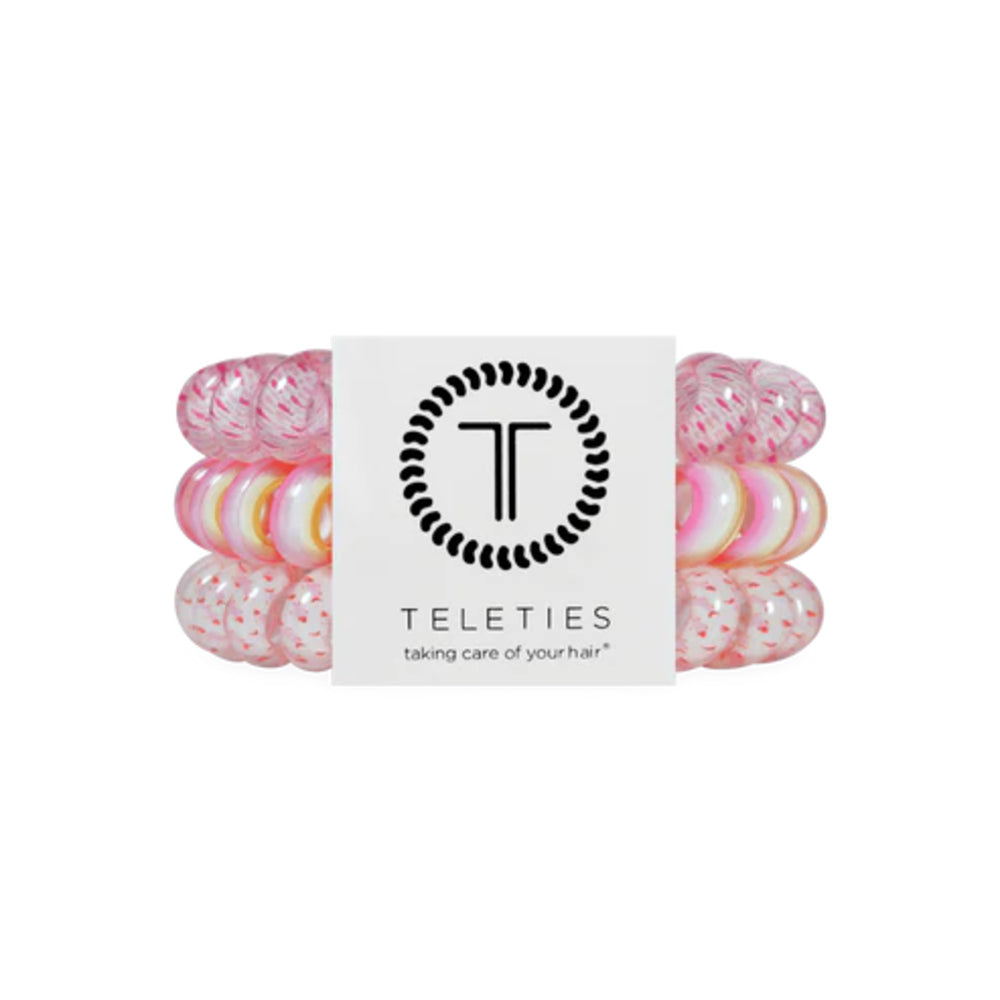 Set of pink hair ties with a 'Teleties' label on a white background