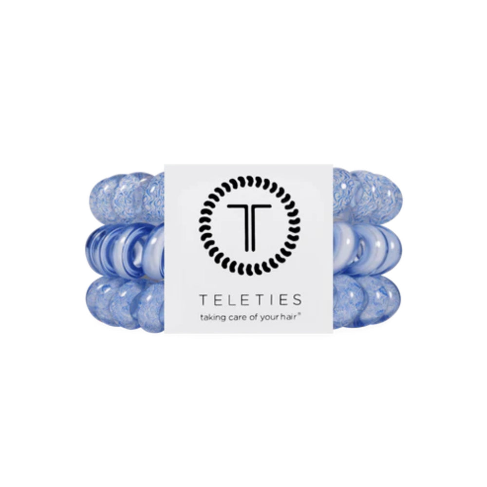 Set of blue hair ties with a Teleties label on a white background