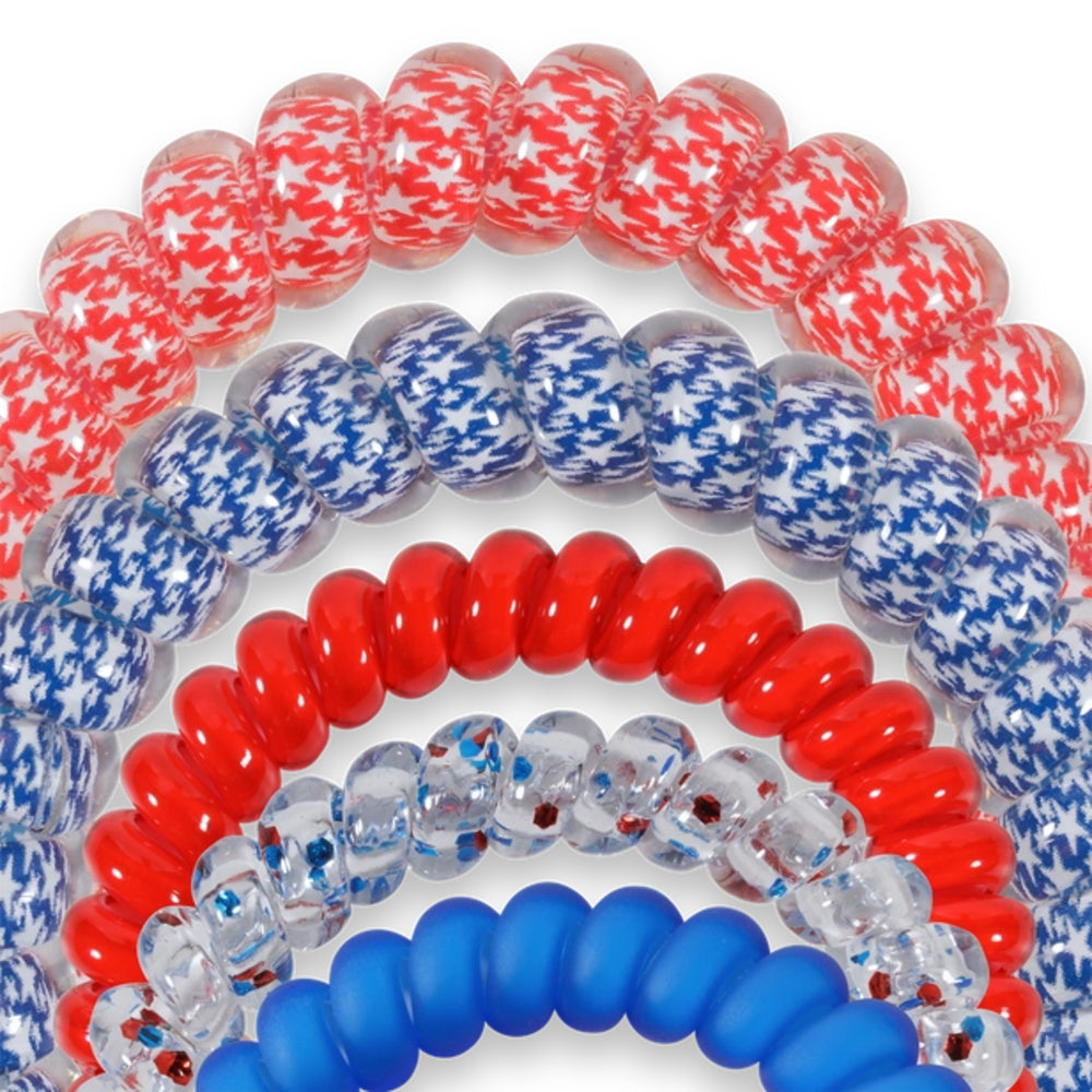 Set of red, white, and blue hair ties on a white background