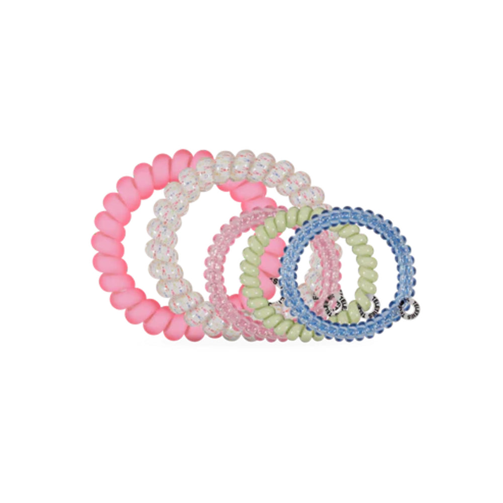 Set of colorful beaded hair ties on a white background