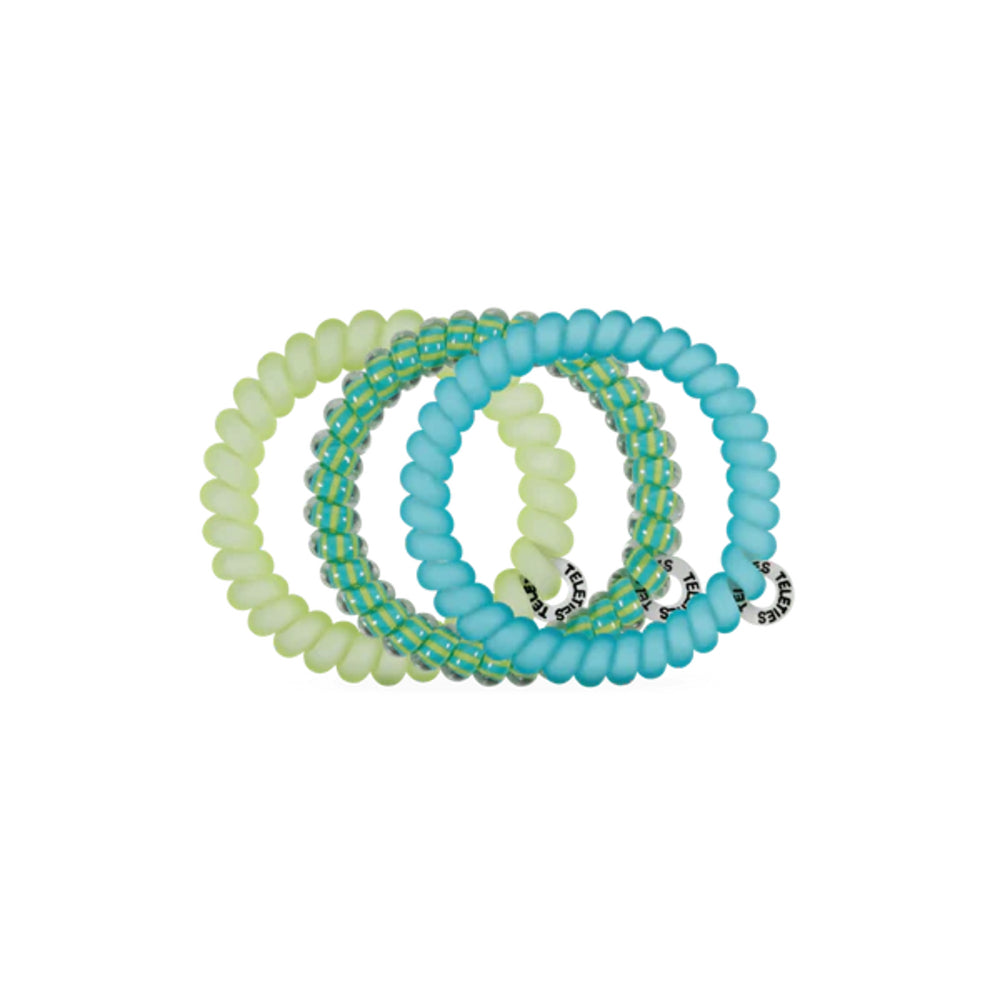 Set of three hair ties in green and blue on a white background