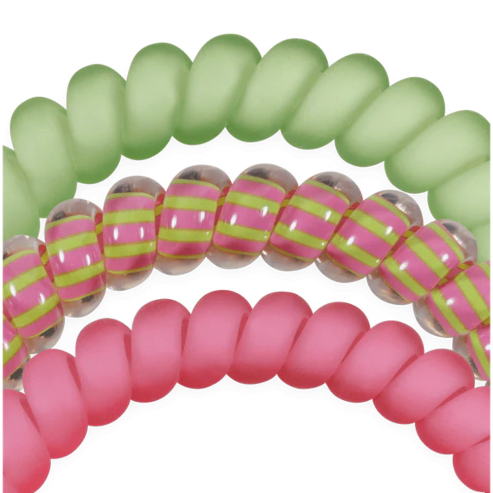 Three hair ties in green, pink with yellow stripes, and pink.