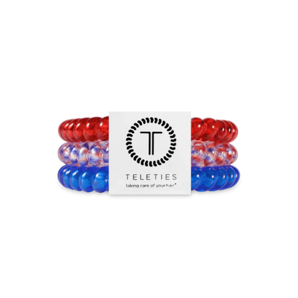 Set of red, white, and blue hair ties with a Teleties branded card on a white background