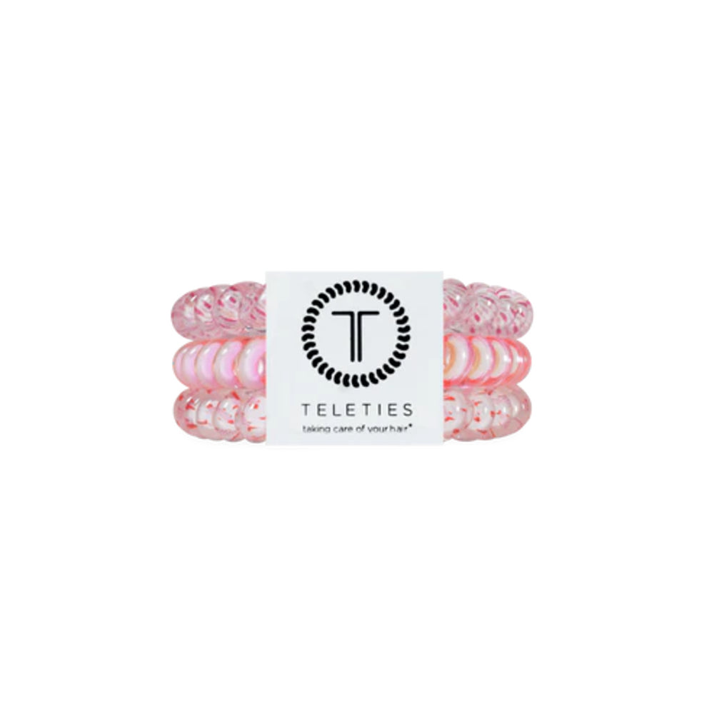 Set of pink hair ties with a Teleties label on a white background