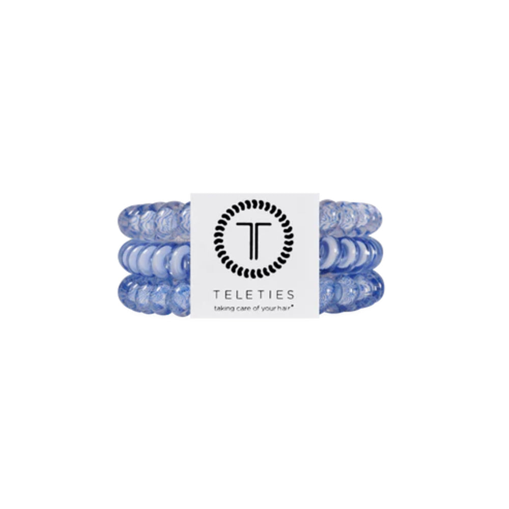 Set of blue hair ties with a Teleties label on a white background