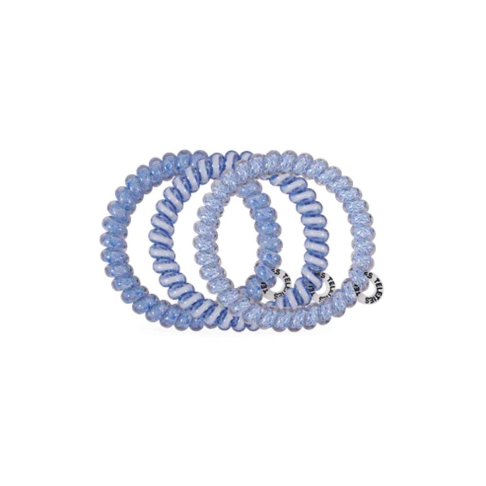 Set of blue hair ties on a white background