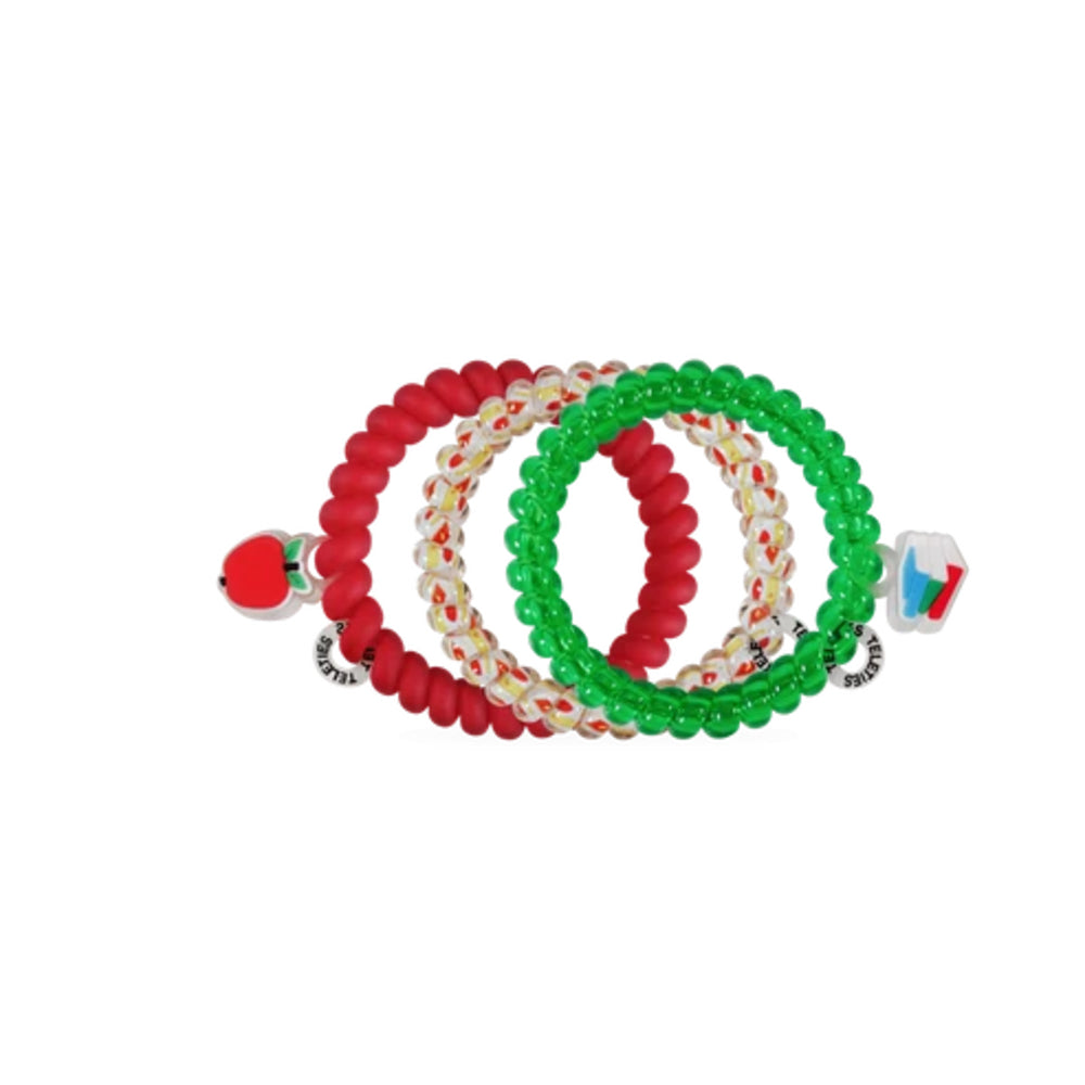 Three beaded stretch bracelets arranged in a fan shape on a plain white background. One bracelet is solid red with a small red apple charm on the end.