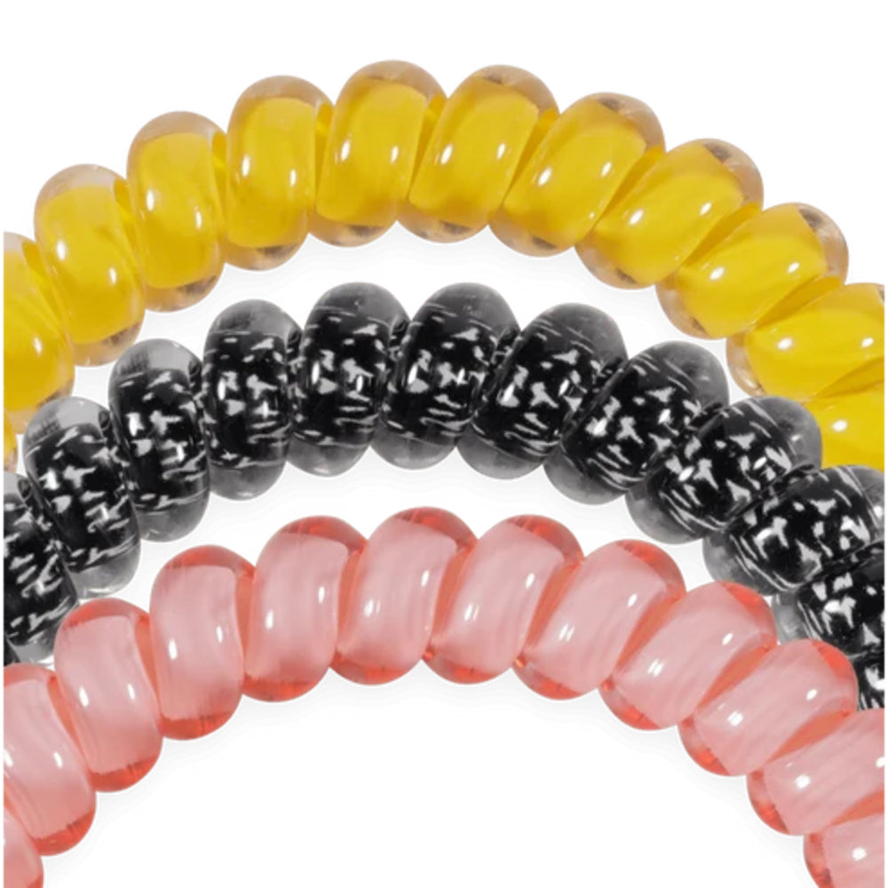 Three translucent beaded stretch bracelets in yellow, black-and-white marbled, and pink, arranged in a stacked circle on a white background.