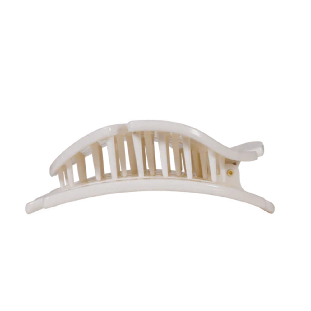 White hair clip with wooden center on a white background