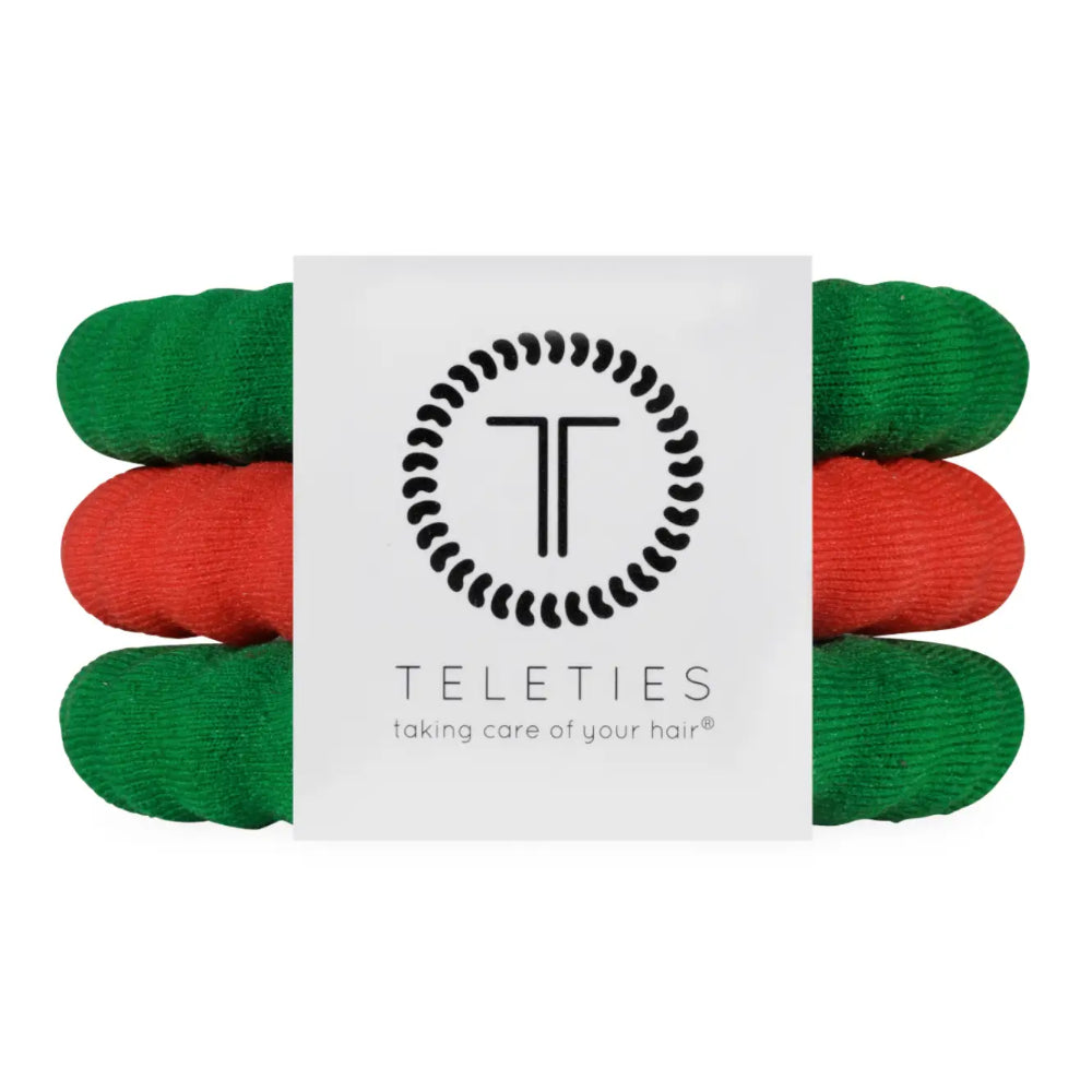 A pack of four Teleties hair care hair ties in green and red, wrapped in a white paper sleeve featuring the black Teleties logo and brand name.