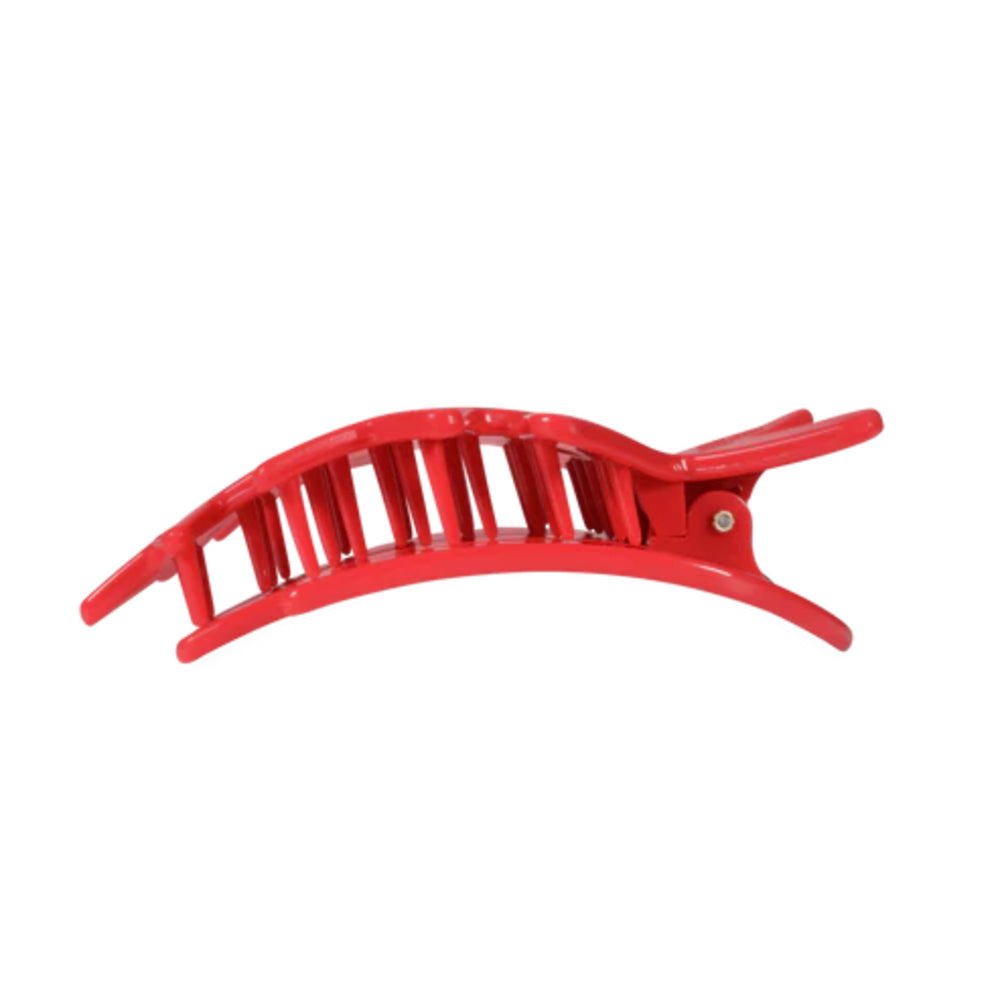 Red hair clip on a white background