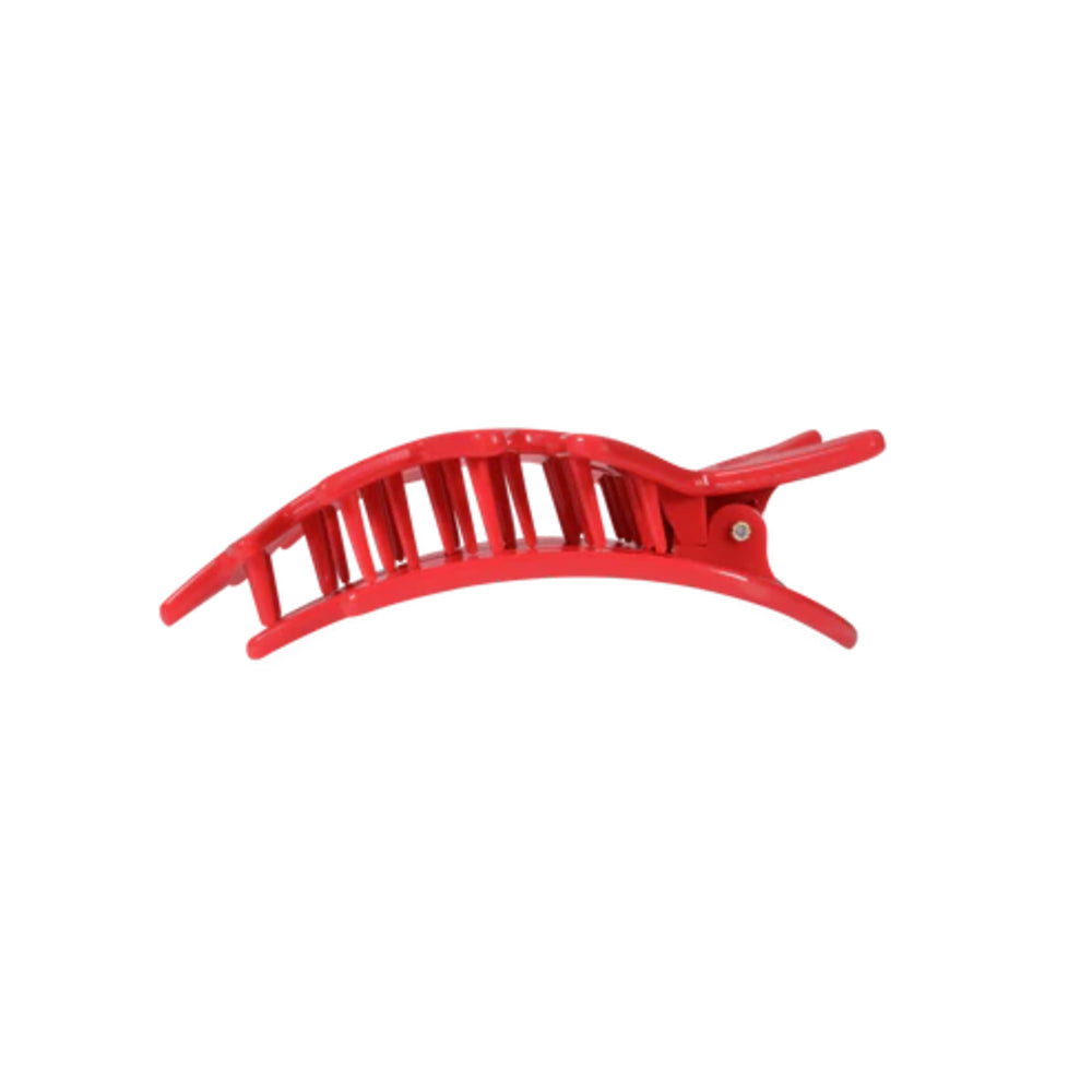 Red hair clip on a white background