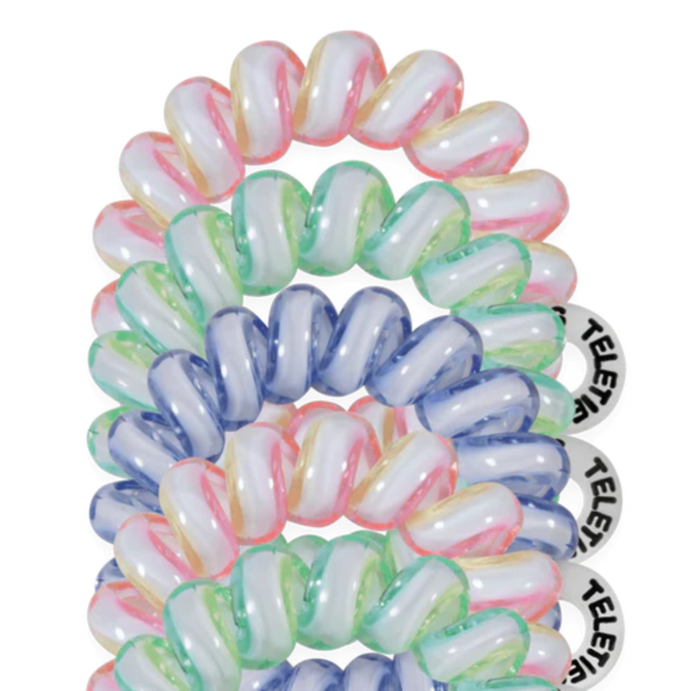 Set of colorful hair ties with visible brand name on a white background